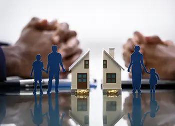 Divorce and family separation — figures, houses and wedding rings