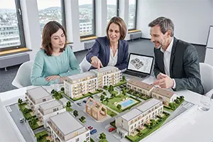 Real estate advisors reviewing a property development model
