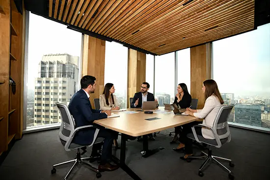 Business meeting in a high-rise office overlooking Santiago